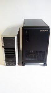 Front view of DEXTER personal computer cluster (R) and a regular tower PC (L)