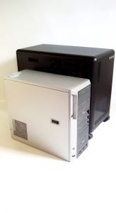 Side view of DEXTER personal computer cluster (R) and a regular tower PC (L)